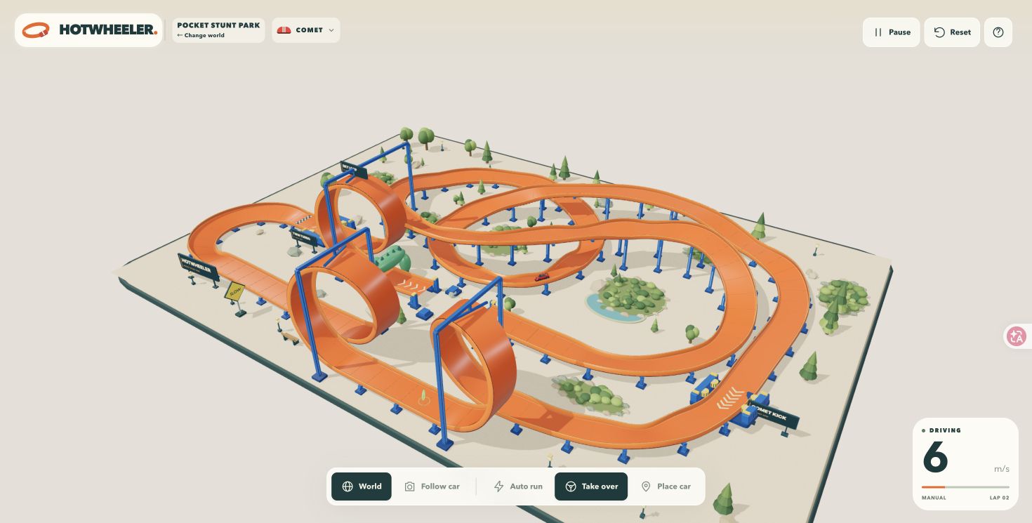 Hot Wheeler — toy cars on an orange track with loops.
